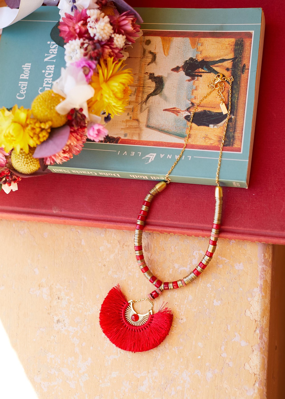 collier pompon rouge